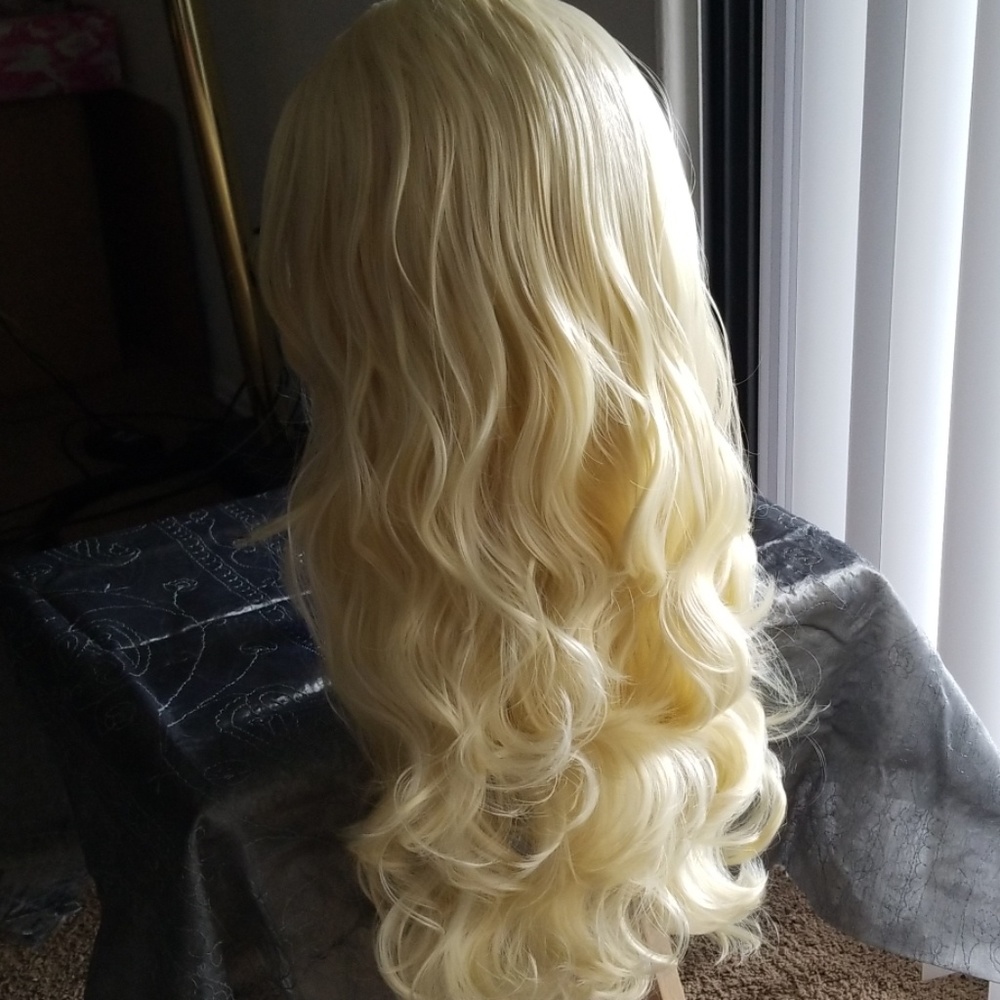 Beautiful blonde loose curl synthetic wig.